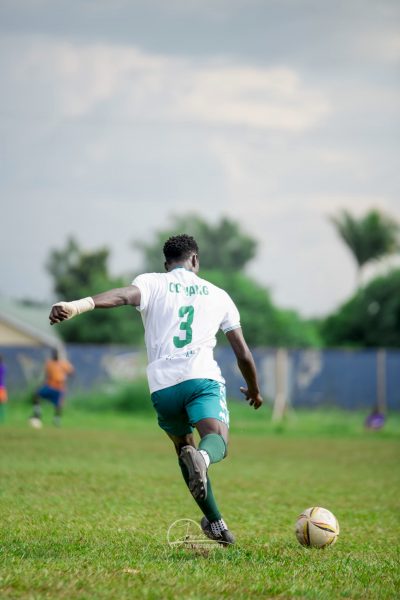 Defender Ogwang kicking a ball!